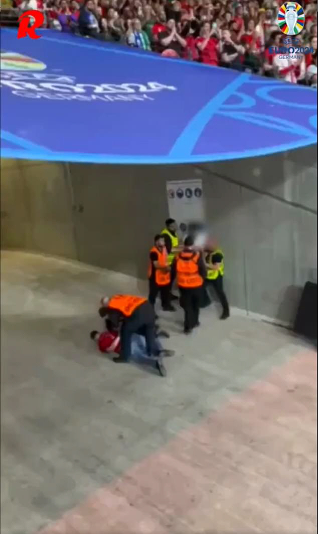 'Shocking'Euro security guard punches and kicks at the fan...The day Ronaldo burst into tears. Is it really the 21st century