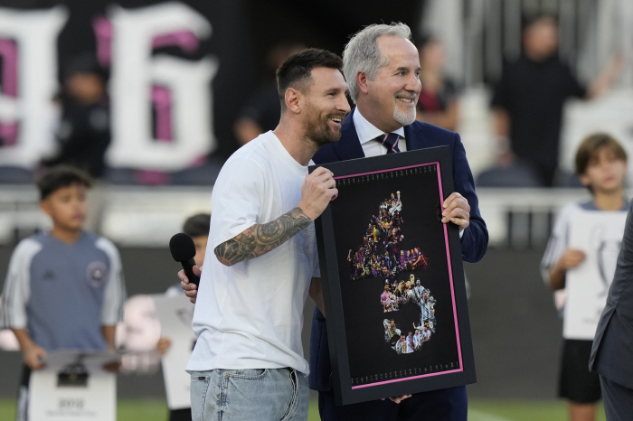 His legs were limp, but his face was full of smiles'GOAT' Messi attends the championship event with a cast on him