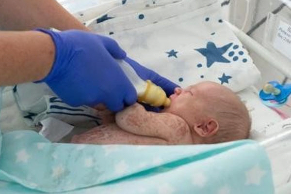 a day-old newborn abandoned in an ant cave