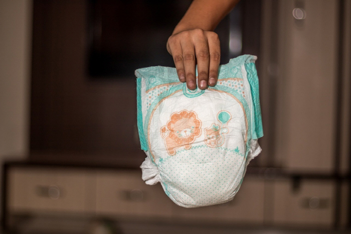 Baby diaper change in flight, 'What are you thinking?'