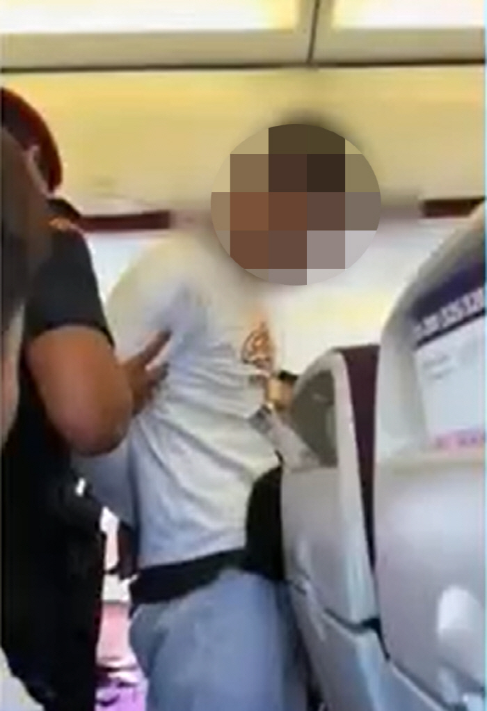 There was a sad story about the man trying to open the plane's emergency exit