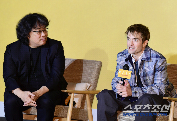  Director Bong Joon Ho with Mickey 17 Robert Pattinson